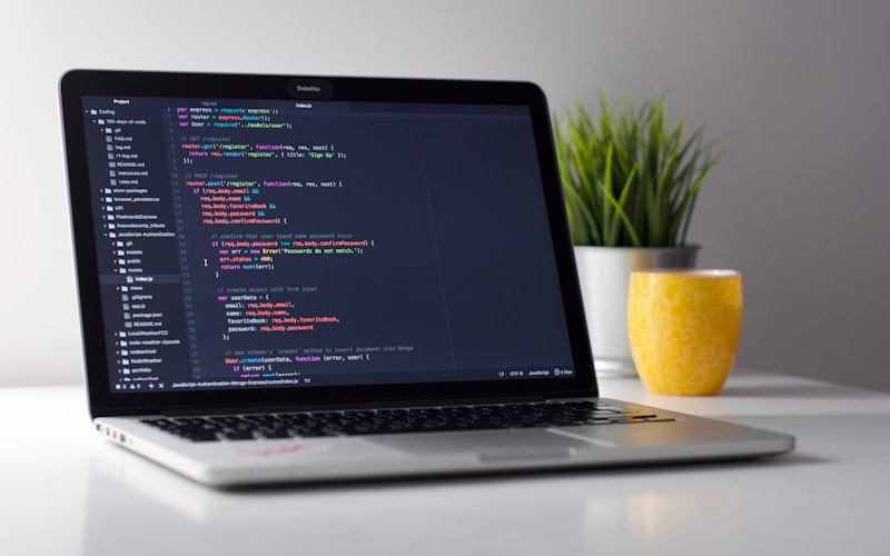Laptop displaying code inside a modern code editor environment