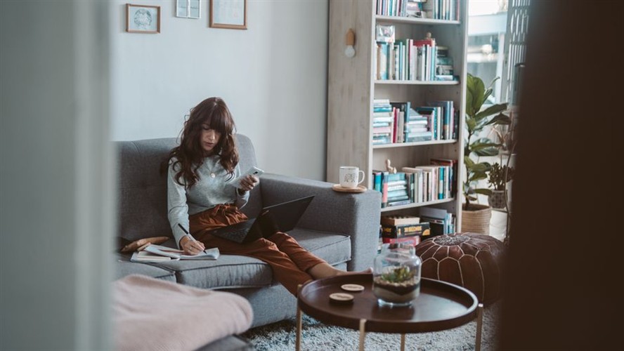 Blog Post Featured Image 2026 Woman Writing Laptop Cozy Setup