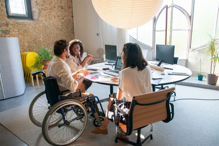Modern Digital Workspace With Diverse Team Using Ai Tools For Accessibility