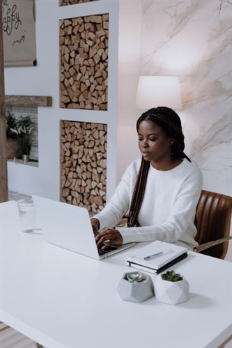 Professional Blogger Working On Laptop In Modern Office 2026